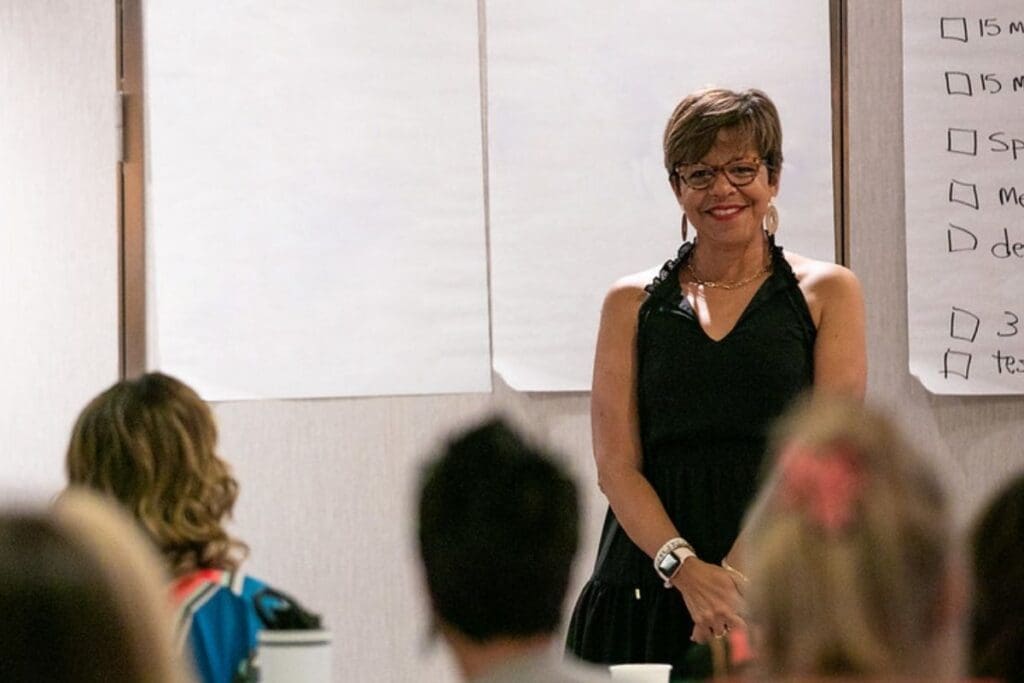 Genevieve Skory presenting with with satisfaction, embodying confidence and success from selling without being pushy.