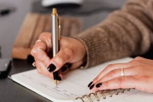 Female entrepreneur reflecting on business growth with confidence.