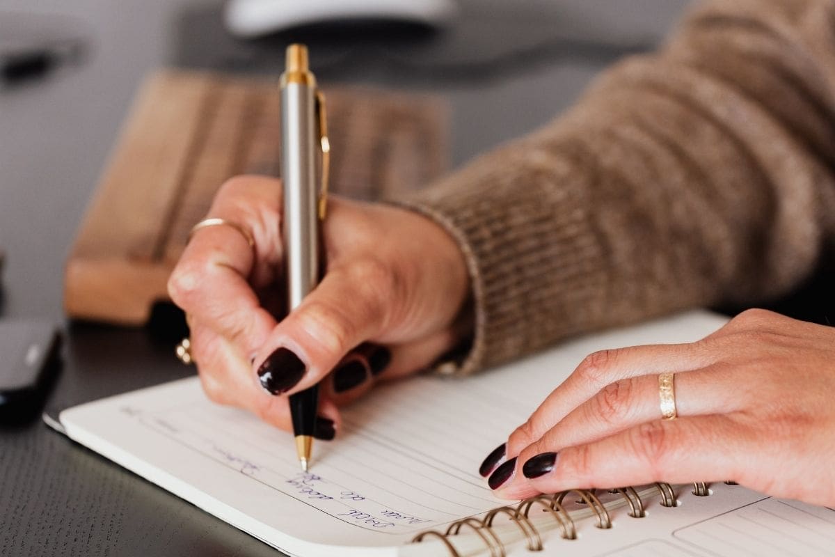 Female entrepreneur reflecting on business growth with confidence.