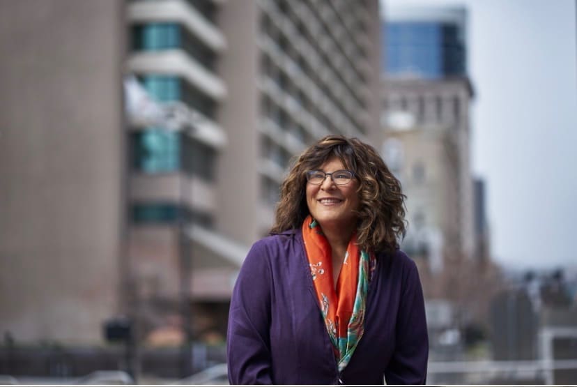 Female in business contemplating Reslience in Business after layoff